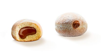 Bild von Mini Beignet Schoko Haselnus mit der Beschreibung Mini Siedegebäck mit Kakao-Haselnuss Füllung und mit Traubenzucker bestreut.