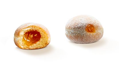 Bild von Mini Beignet mit Aprikosen Fül mit der Beschreibung Mini Siedegebäck mit Aprikosen Füllung und mit Traubenzucker bestreut.