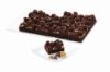 Bild von Caramel Nut Brownie mit der Beschreibung Saftiger Schoko-Brownie mit Karamellcreme, knackigen Walnüssen und feinen Schokokringeln